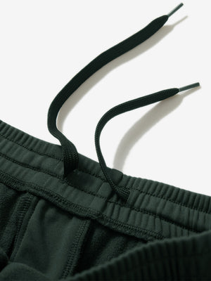 Close-up of the waistband with drawstring detail of forest green fleece stretch water resistant boys joggers.