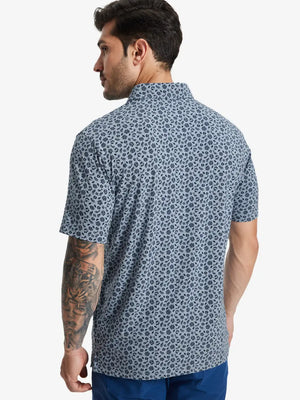 Back half-body view of model in GRAYISH BLUE FLOWER Popular Heather Print Polo