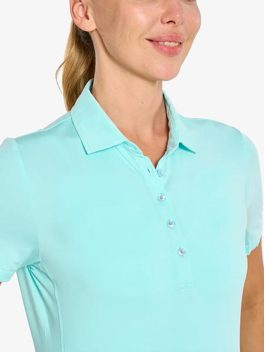 Close-up front view from nose to chest in BLUE LIGHT Women's Performance Solid Polo
