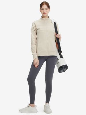 Women's Water-Resistant Stretch Fleece Lined Jacket in light khaki , model holding golf bag