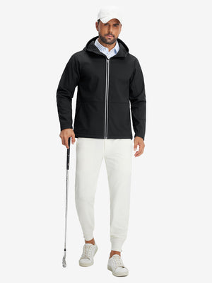 Model holding a golf club, wearing black reflective hooded softshell jacket in full-body view.