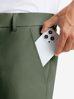 iPhone placed inside pocket of the Olive Green Quick Dry Casual Shorts, showing storage space.