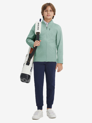 Full-body view of model wearing kids soft lightweight fleece lined jacket in dusty green, displaying the jacket's fit and design.