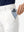 Detail view of front pocket on white women's regular fit stretchy golf pants