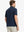 Rear half-body view of Everyday Solid Jersey Polo in NAVY, showcasing clean lines and fit.
