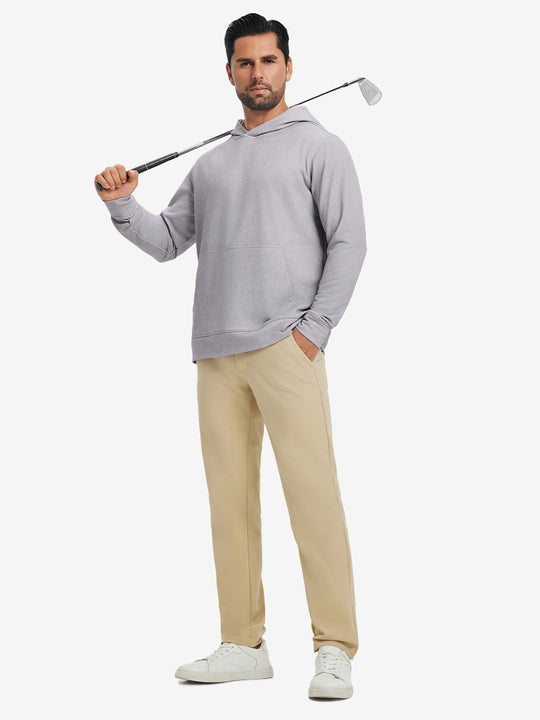 Full-body view of model in light purple exclusive print kangaroo hoodies holding a golf club outdoors.
