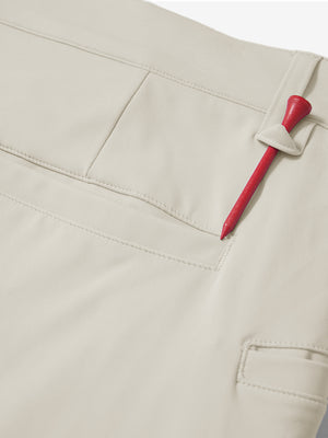 Waistband detail of soft lightweight casual golf pants with 5 pockets in cream, neat stitching.