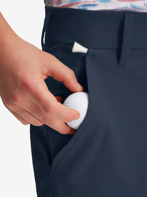 Detail: pocket of navy boys lightweight dry fit flat front golf shorts