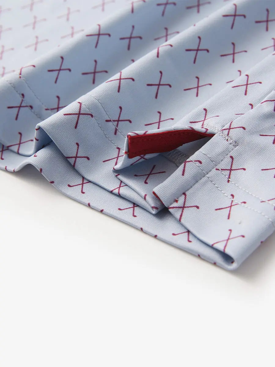 Detail view of the grey and burgundy combo polo shirt, highlighting the tailored hem opening for a sleek look.