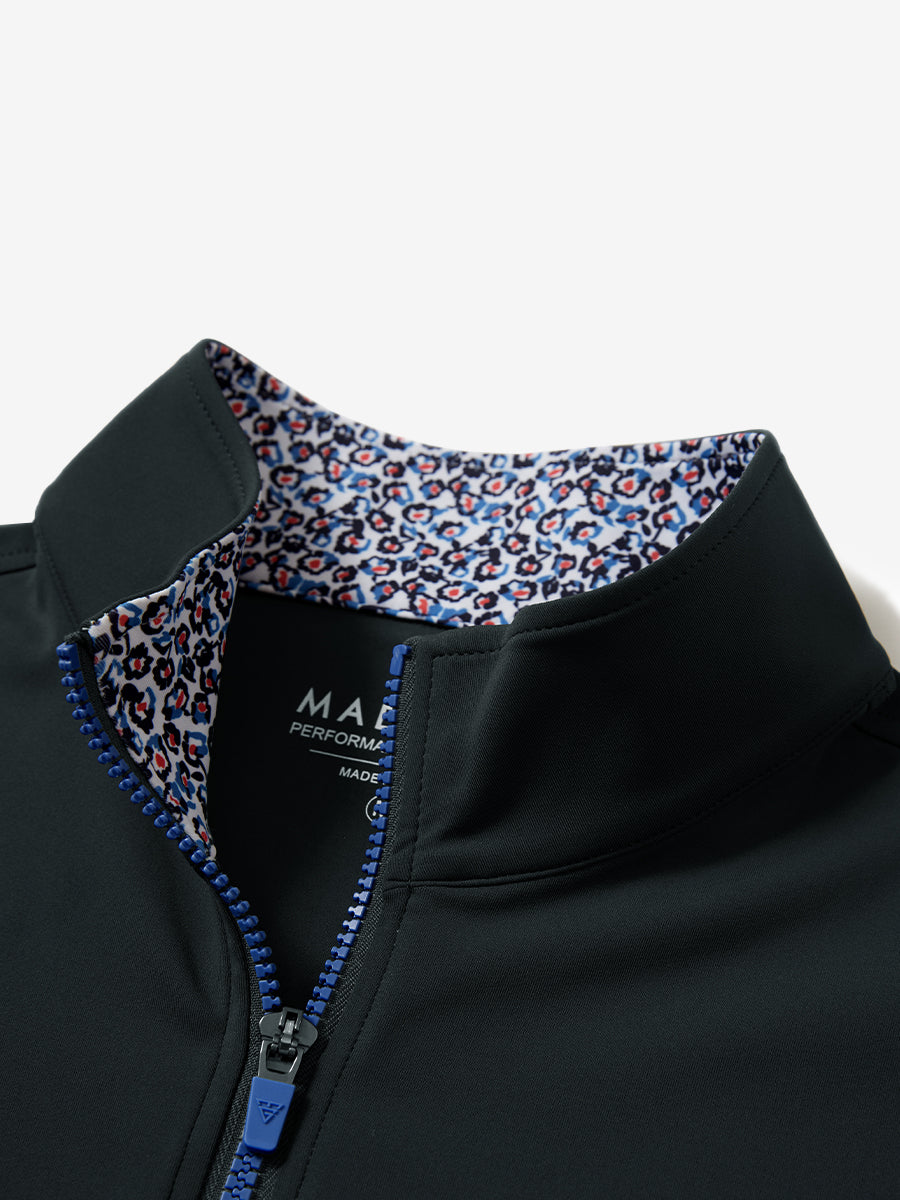 Collar zipper and inner neck pattern detail of the lightweight golf quarter zip pullover in dark grey.