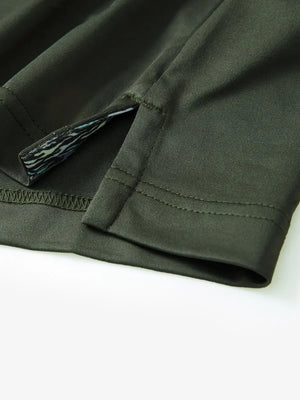 Close-up of side slit detail on the Olive Green Everyday Classic Solid Polo hem
