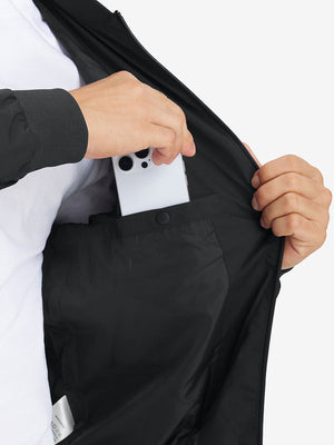 Hand placing iPhone into inner pocket of casual windproof bomber jacket in black
