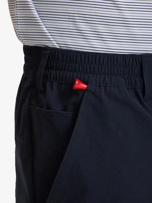 Side pocket close-up with golf tee holder on Performance Water Resistant Pants in NAVY