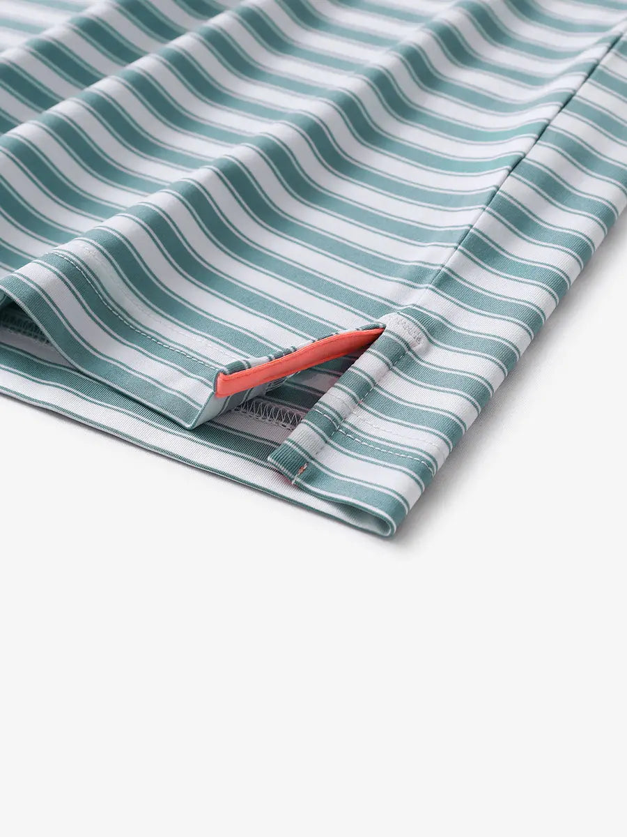 Close-up of the hem slit on the Haze Blue White Yarn Dyed Stripe Polo – tailored and functional