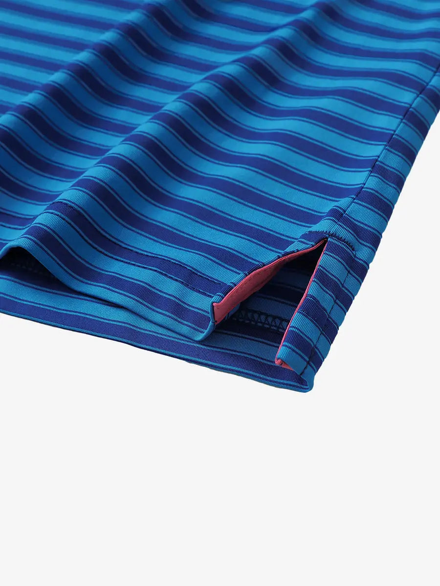 Close-up of the hem slit on the Dark Blue Yarn Dyed Stripe Polo – subtle detail for added flexibility