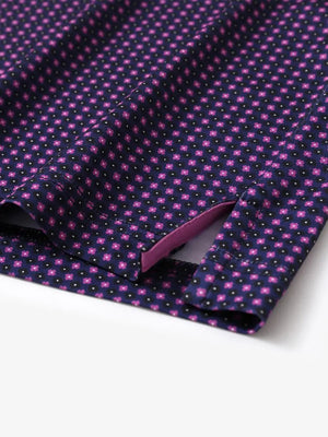 Hem slit detail of MAELREG Performance Jersey Print Polo in Black Purple Flower – comfort & movement