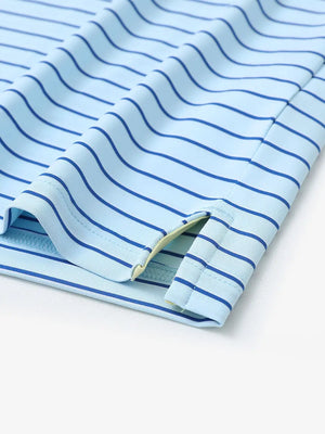 Hem slit detail of LIGHT BLUE/COBALT STRIPE Youth Performance Golf Polo highlighting stitching and finish.