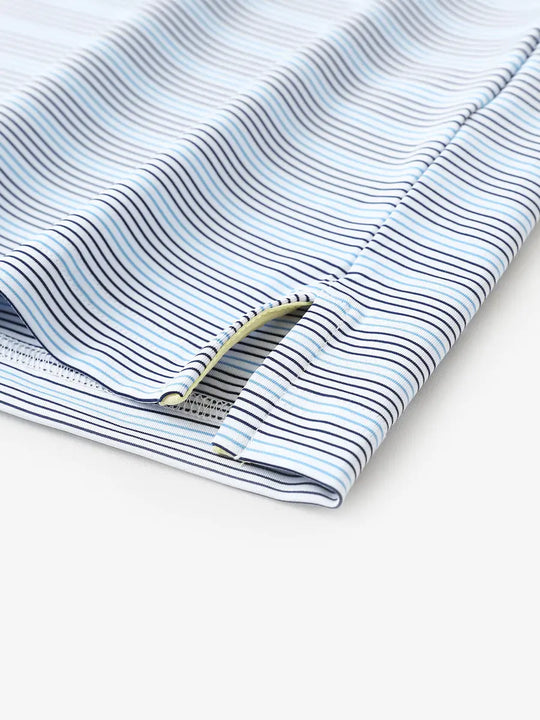 Close-up of side hem slit on Navy Blue Stripe Performance Stripe Golf Shirt