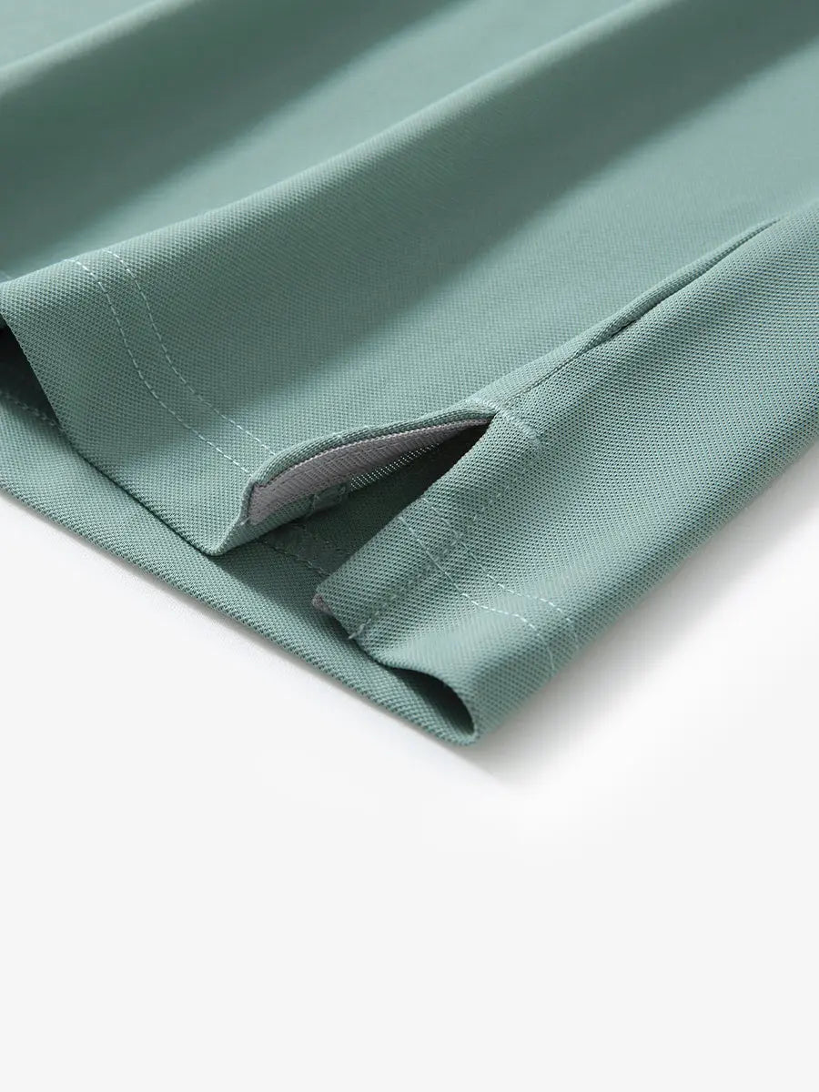 Detail shot of hem opening on BERYL GREEN Ventilated Pique Performance Polo