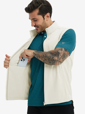 Close-up of water-resistant fleece golf vests pocket holding a phone, practical detail in cream