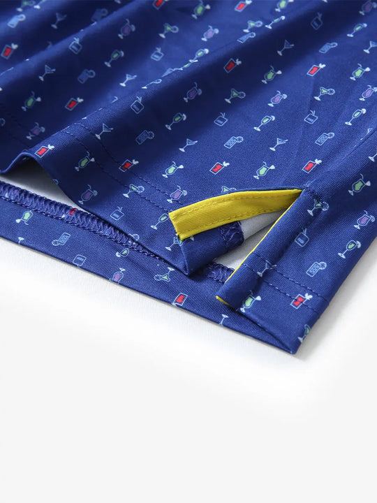 Showcasing the corner openings of a navy cocktail polo shirt, the lightweight, fluid design and fine stitching present the perfect combination of elegance and functionality.