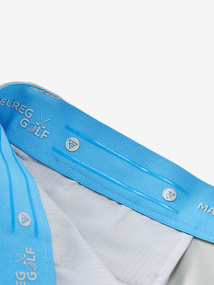 Inside waistband detail of water-resistant golf stretch nylon pants featuring maelreg logo, glacier grey.