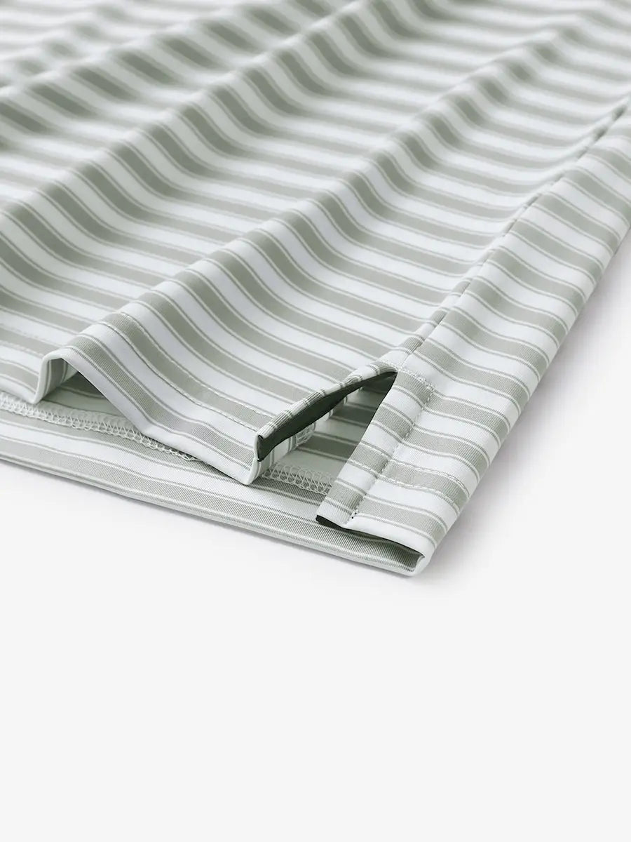 Close-up of the hem slit on the Grey White Yarn Dyed Stripe Polo – functional and stylish