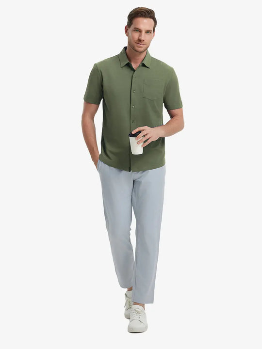 Full-body view of model holding takeaway drink cup in OLIVE GREEN Cotton Blend Plain Shirt.