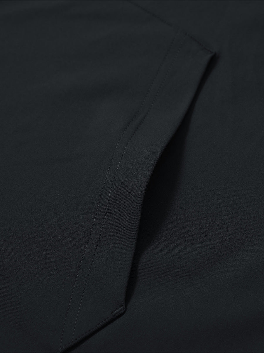 Close-up of single pocket detail on youth long sleeve hoodied with kangaroo pocket in black, showing stitching.
