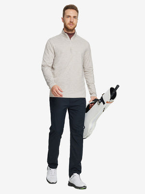 Man wearing Heather Pinstripe Brushed Dry Fit Quarter Zip Pullover in taupe heather, holding golf club on course