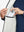 Inner pocket detail of Lightweight Water Resistant Puffer Vest in white, holding smartphone
