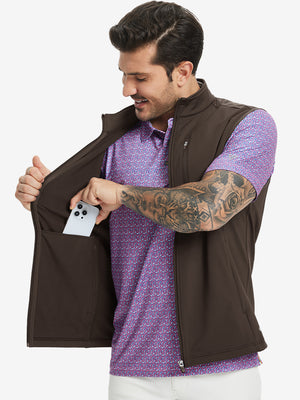 Close-up of water-resistant fleece golf vests pocket holding a phone, practical detail in coffee brown