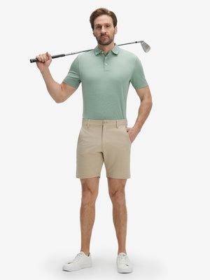 Full-body shot of model holding a golf club in grey green ultra-light quick dry moisture wicking collared polo shirt