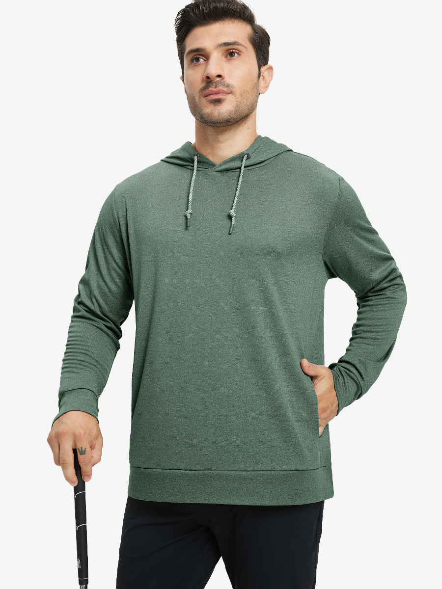 Model with one hand in pocket, wearing classic heather pullover hoodie in dark green melange, relaxed look.
