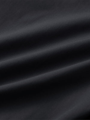 Material detail of Water resistant everyday pants showing smooth finish in dark grey