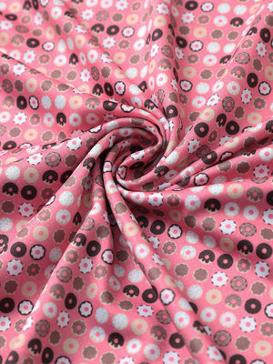 Fabric detail of Stylish print boys polo shirts with soft feel and pink donut pattern