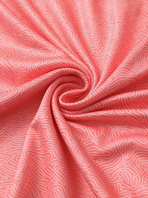 Close-up of candy pink line golf performance print boys golf polo fabric showing moisture-wicking texture 