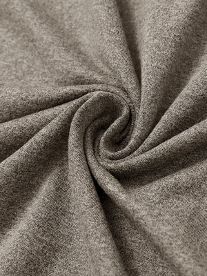 Close-up of melange fabric on quarter zip pullover, showing texture and detail in brown melange.