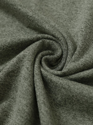 Close-up fabric detail of skin-friendly long sleeve melange polo, soft blend texture with olive green heather tone