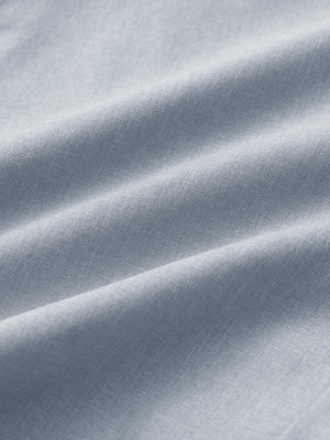 Close-up of glacier grey heather performance golf shorts fabric showing breathable texture.