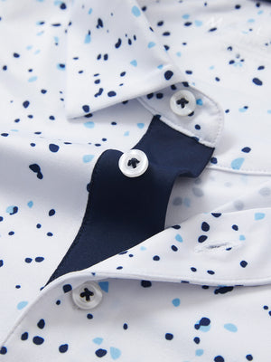 Detail shot of the collar on the blue navy dot 4 way stretch print collared polo shirt, emphasizing the classic neckline design