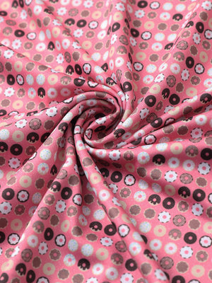 Fabric close-up of Everyday performance print polo with lightweight texture in pink donut