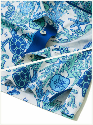 Detail: collar and hem slit of sea turtle performance print boys golf polo