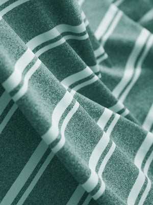 Fabric close-up of Performance yarn dye striped polo showing crisp stripes and dark green stripe detail