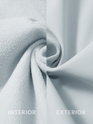 Close-up of the inner and outer fabric of winter thermal outdoor water resistant fleece jacket in light gray, showing fleece lining and exterior.