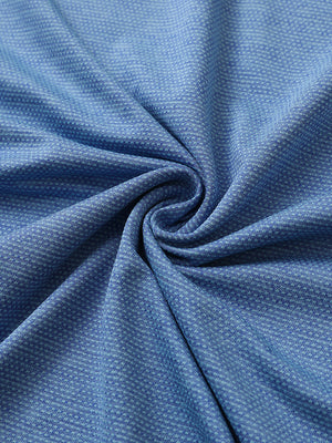 Close-up of classic blue ventilated heather jacquard polo fabric showing breathable texture and subtle pattern details.