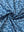Close-up of blue white butterfly performance jersey print polo fabric showing breathable texture and vibrant pattern details.