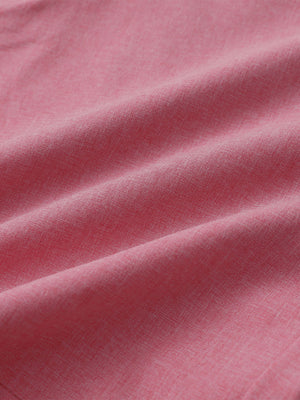 Close-up of pink heather performance golf shorts fabric showing moisture-wicking texture.