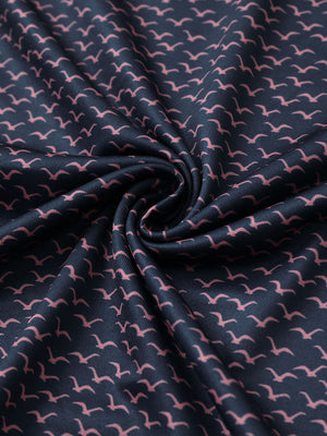 Texture detail of Performance jersey print polo with soft stretch in navy pink seagull