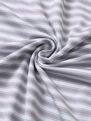 Close-up of lavender white yarn dyed stripe polo fabric showing distinct woven stripes and textured surface.